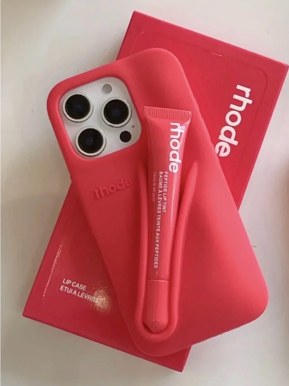 RHODE Guava Spritz Silicone iPhone Case with Lip Tint Holder. Lip tint not inc.